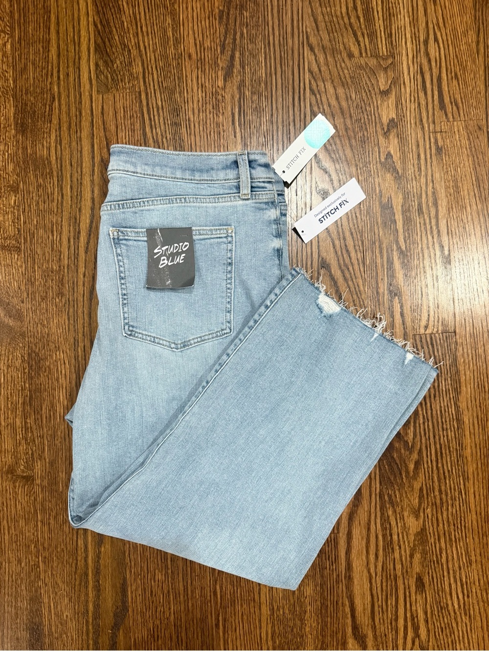 Studio Blue Light Wash Frayed Hem Jeans